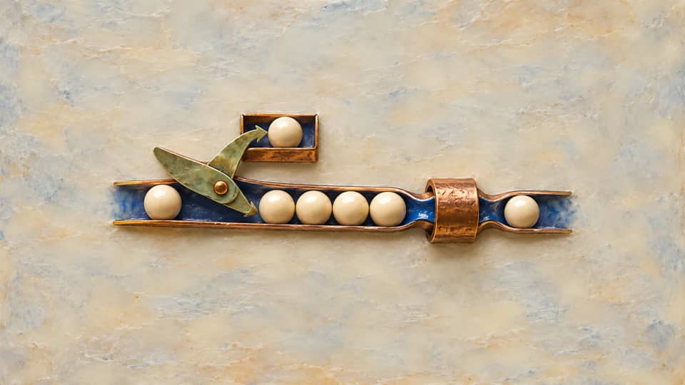 Request beads wait before a copper-wrapped throat while an upstream paddle diverts one bead into a separate tray.